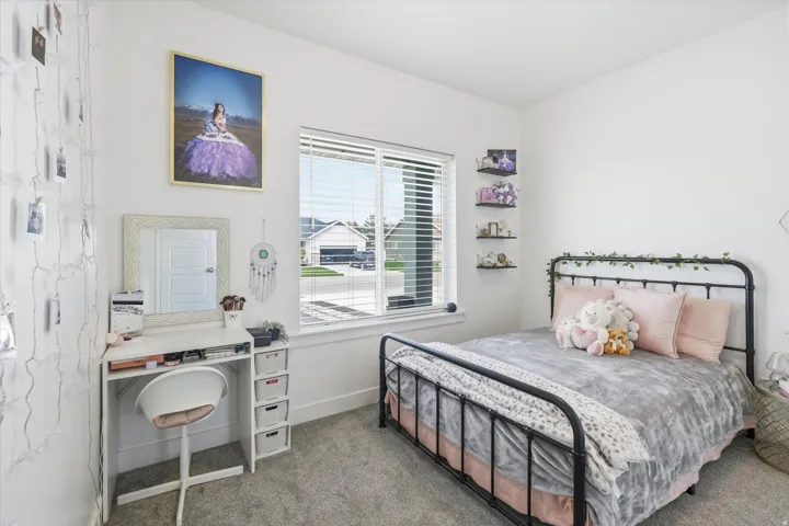 Bedroom 2 featuring carpet flooring and baseboards