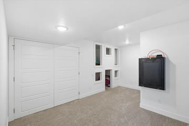 Finished basement with baseboards and carpet floors
