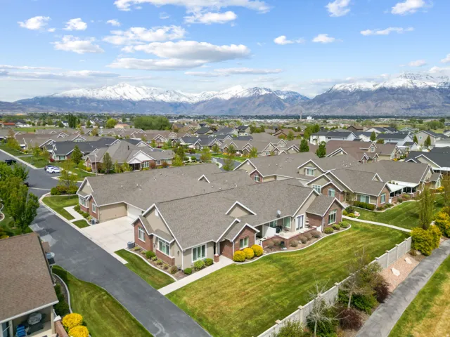 Aerial view of residential area featuring a mountainous background