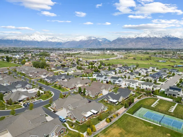 Aerial view of residential area featuring a mountainous background