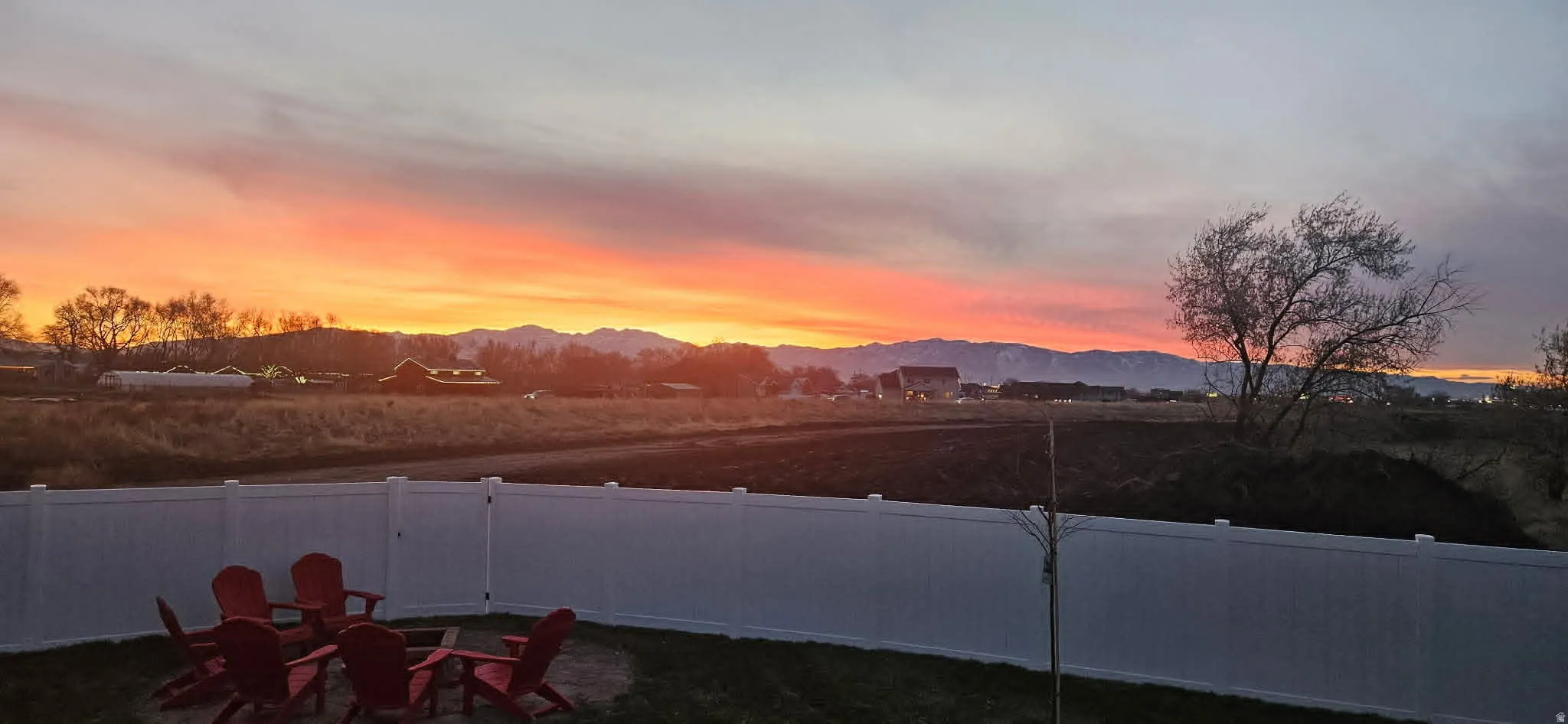 Fenced backyard with a mountain view