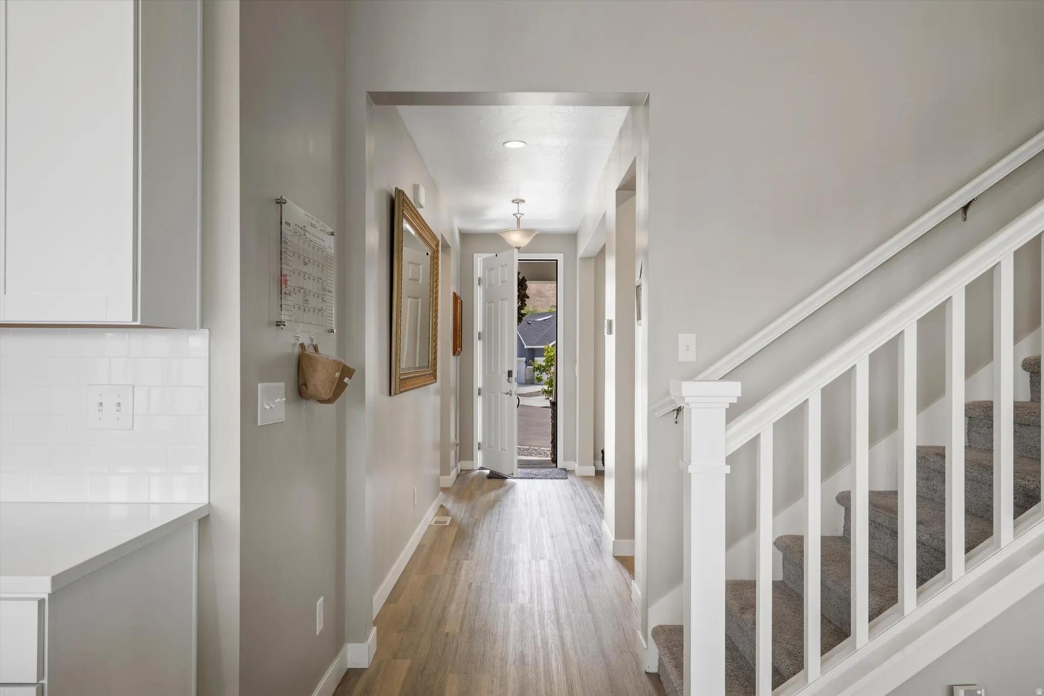 Entrance foyer featuring wood finished floors and recessed lighting