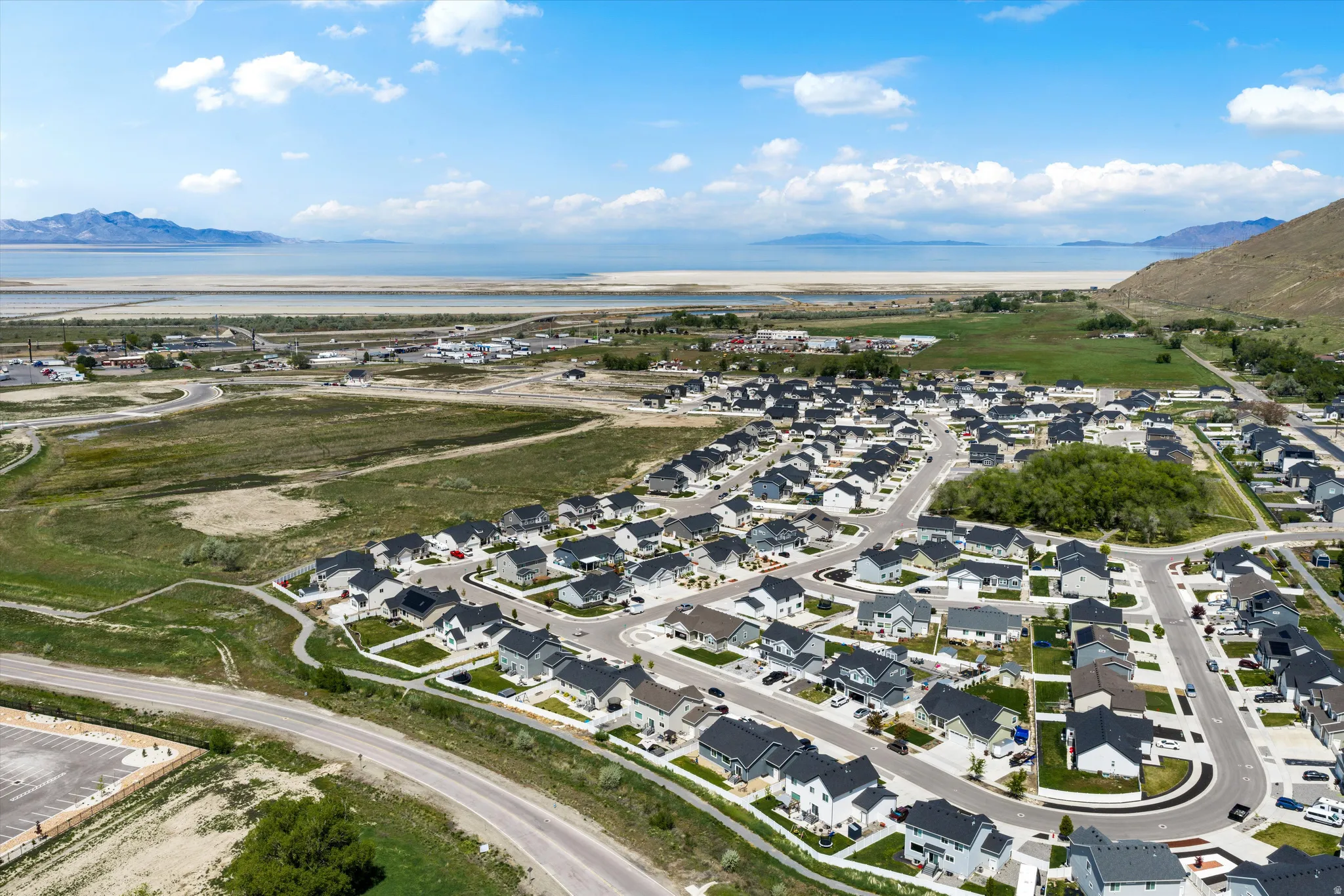 Aerial view of residential area featuring a water and mountain view