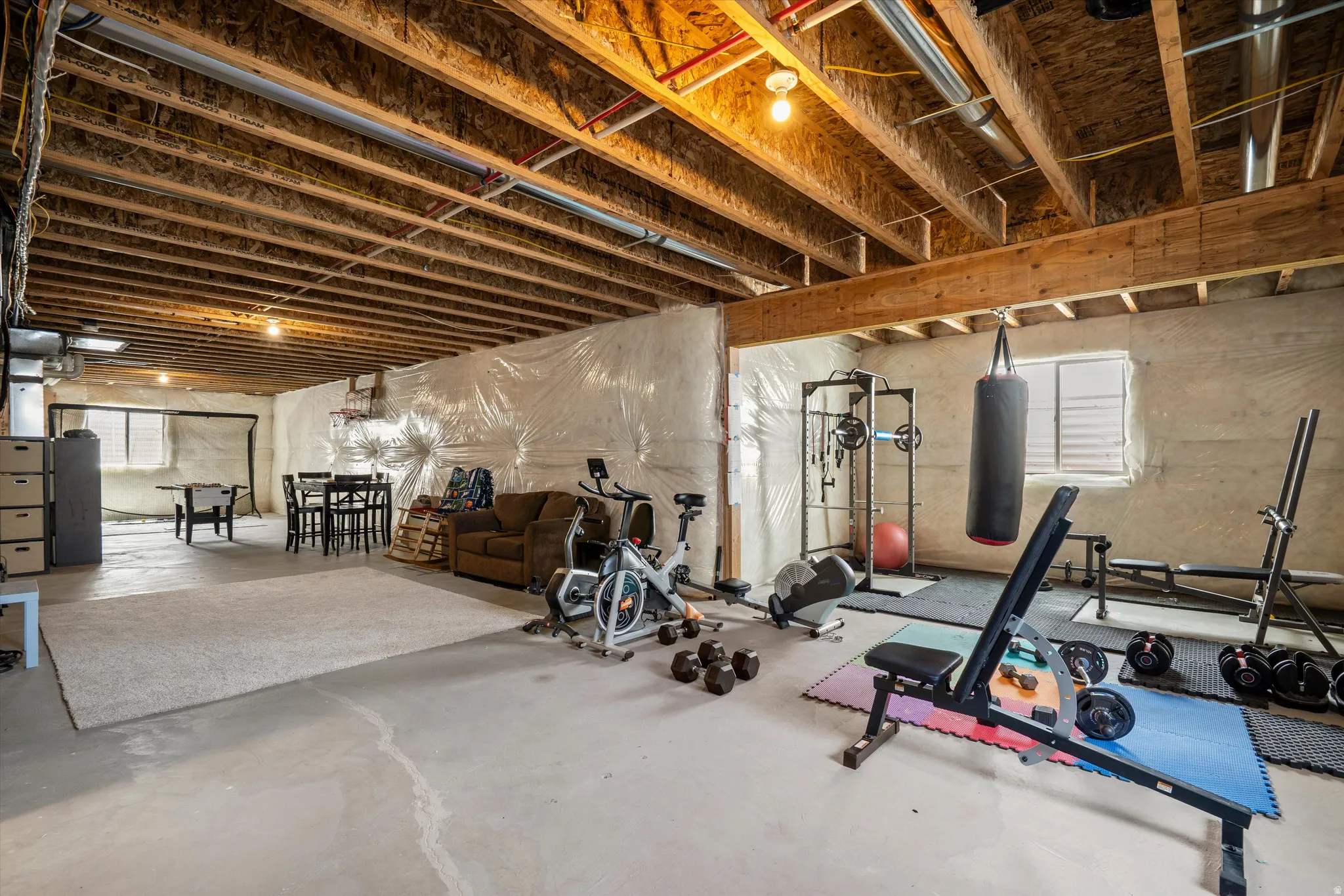 Workout room featuring concrete flooring