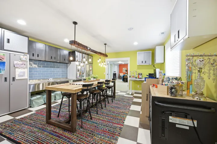 Dining area featuring dark floors and recessed lighting