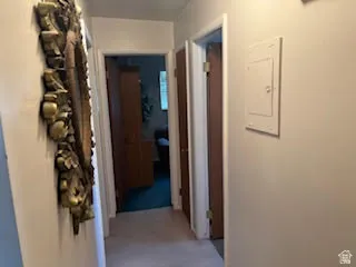 Hallway featuring electric panel