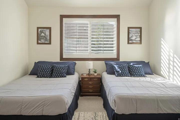 Bedroom with light carpet