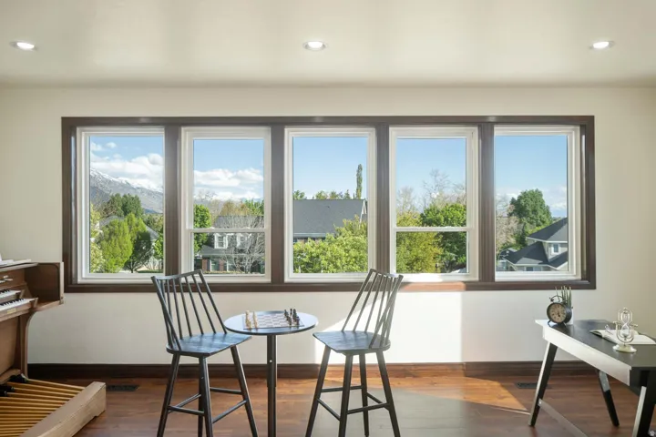 Dining room featuring wood-type flooring, plenty of natural light, and recessed lighting