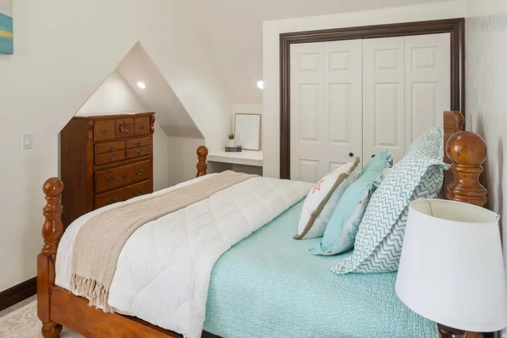 Bedroom with a closet, recessed lighting, and lofted ceiling
