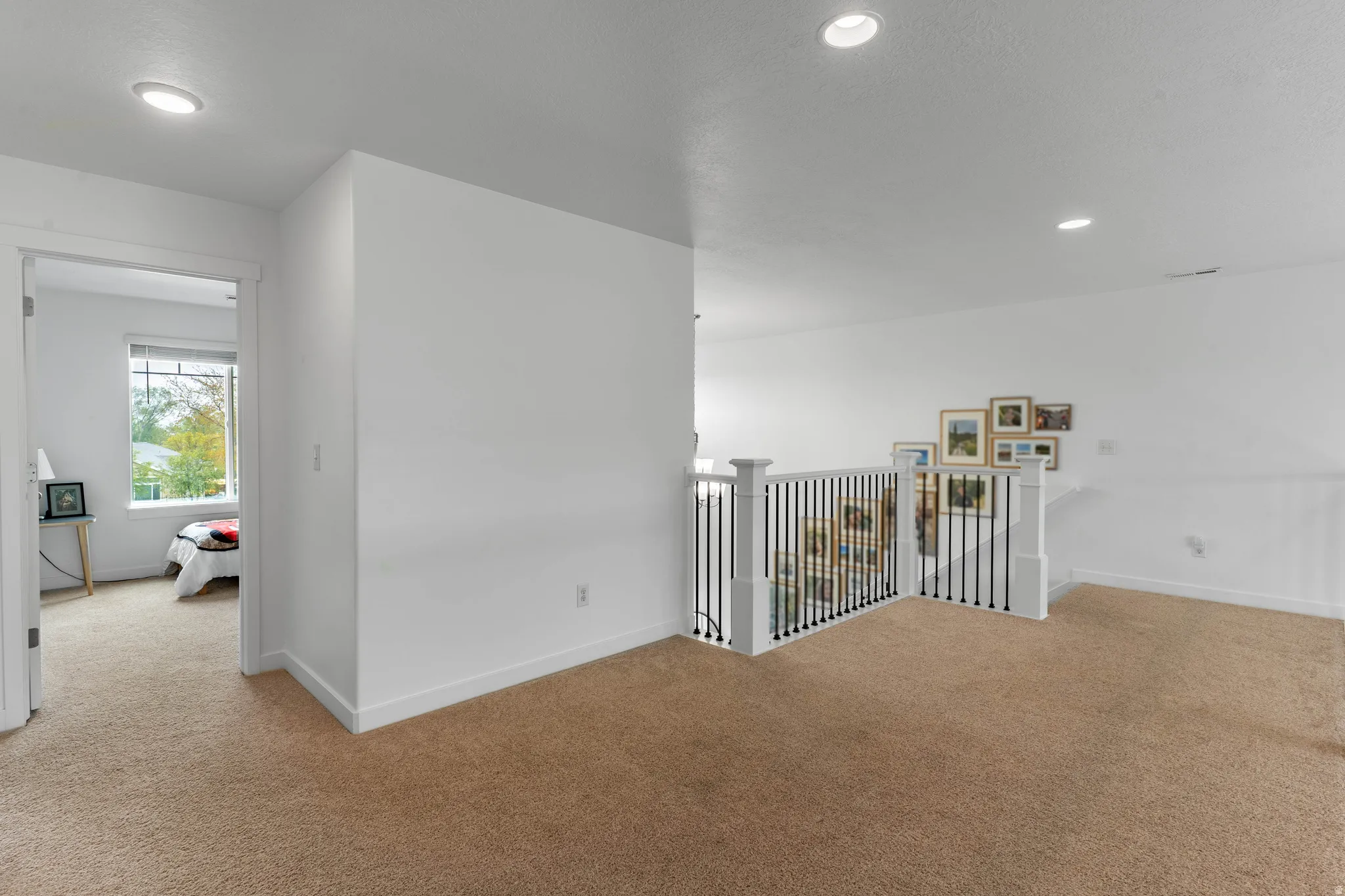 Hallway with carpet flooring and recessed lighting