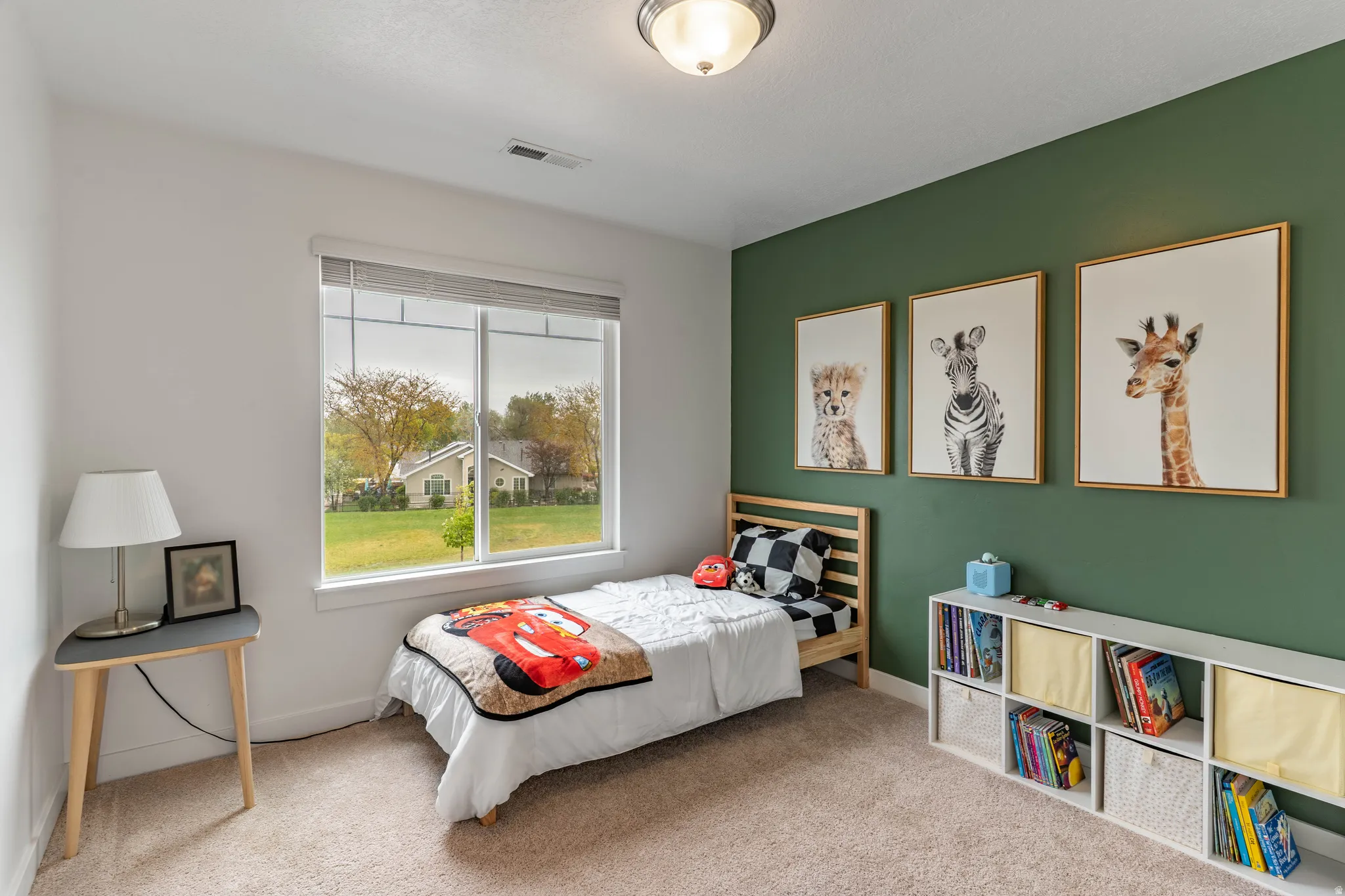 Bedroom with light carpet and baseboards