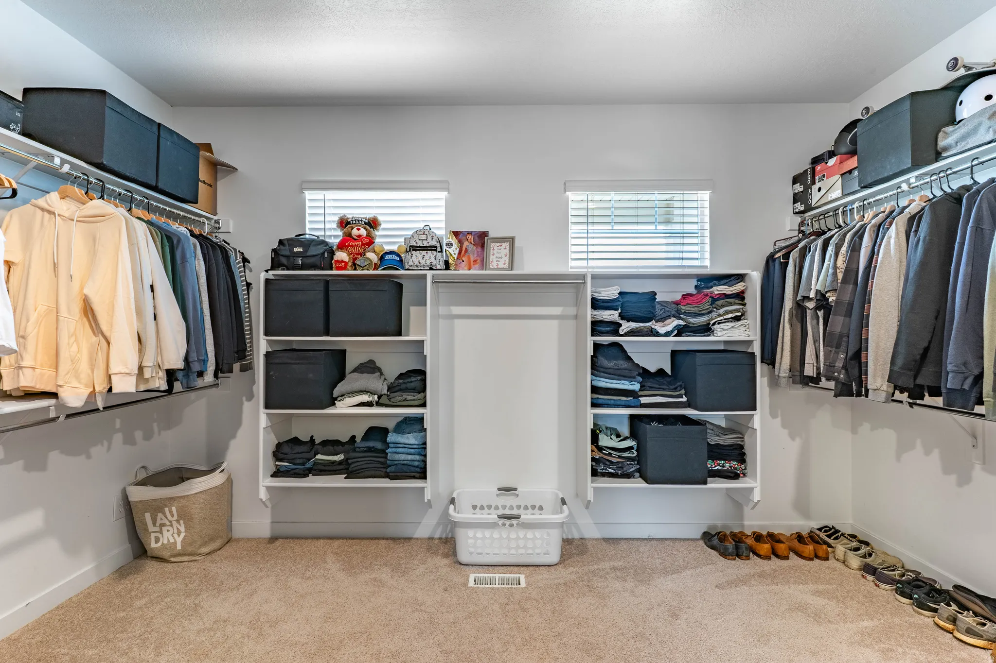Walk in closet featuring carpet