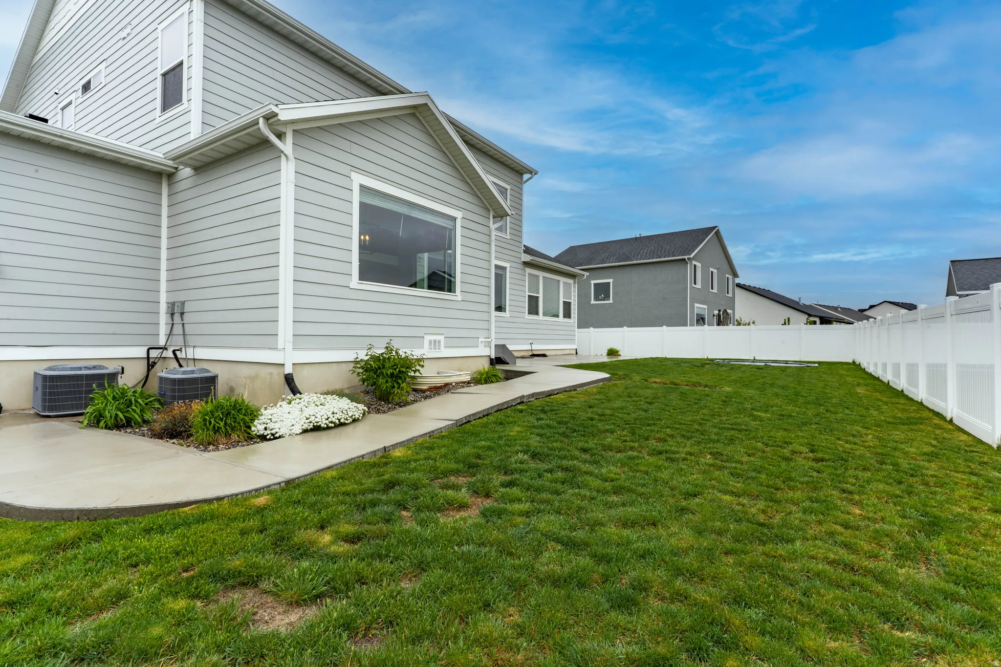 Rear view of property featuring a fenced backyard