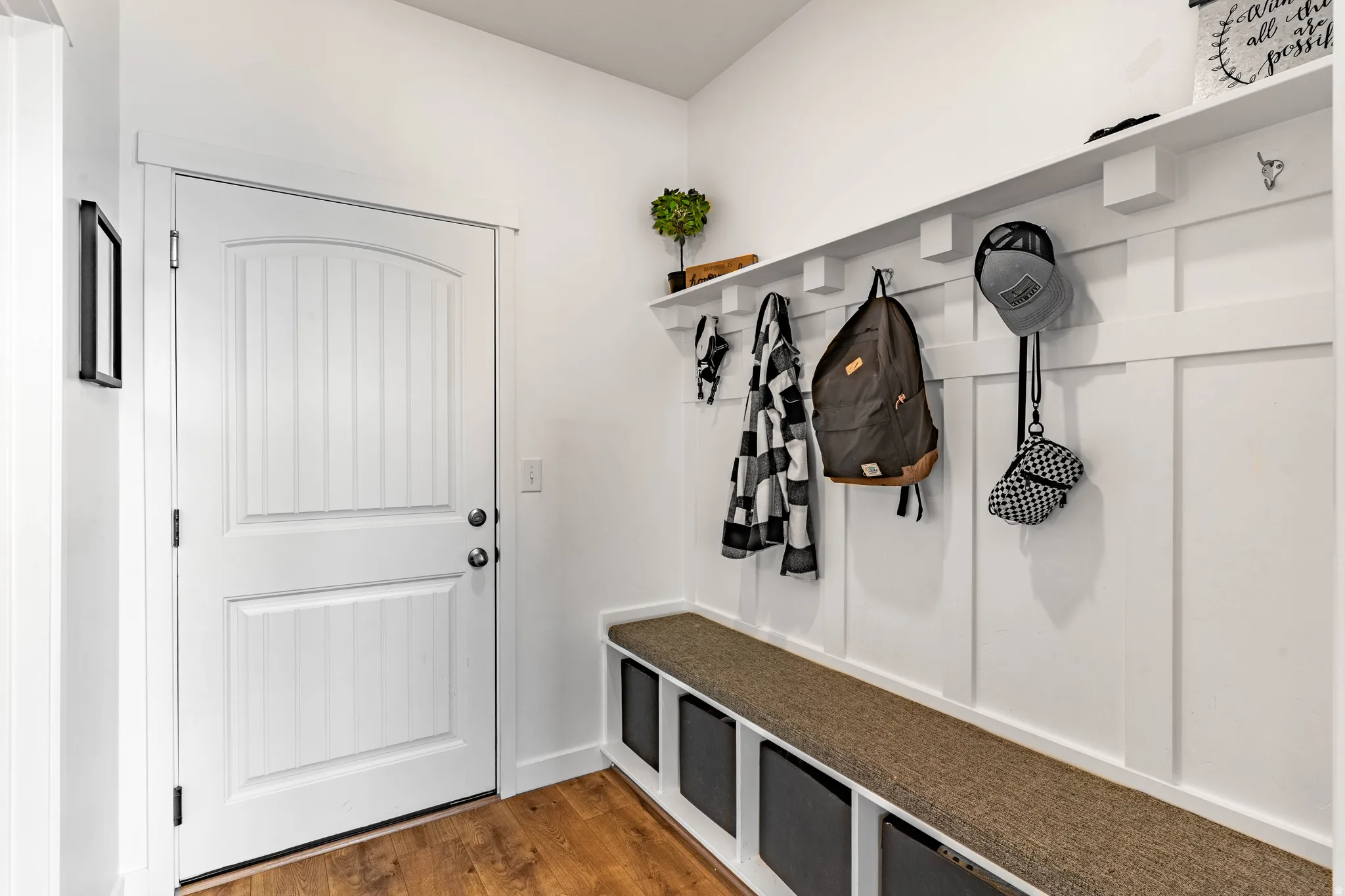 Mudroom featuring dark wood finished floors