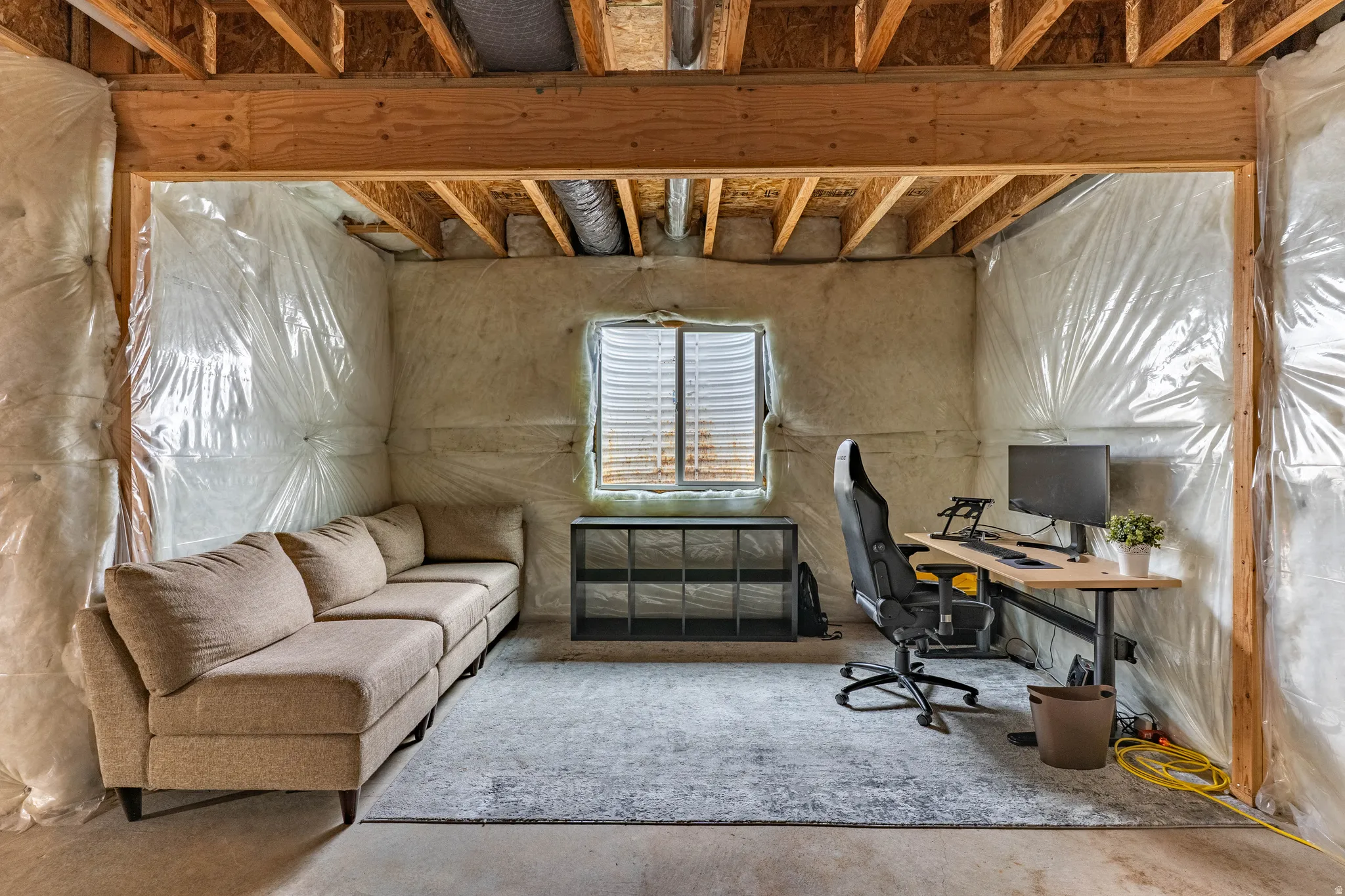 Office featuring unfinished concrete floors