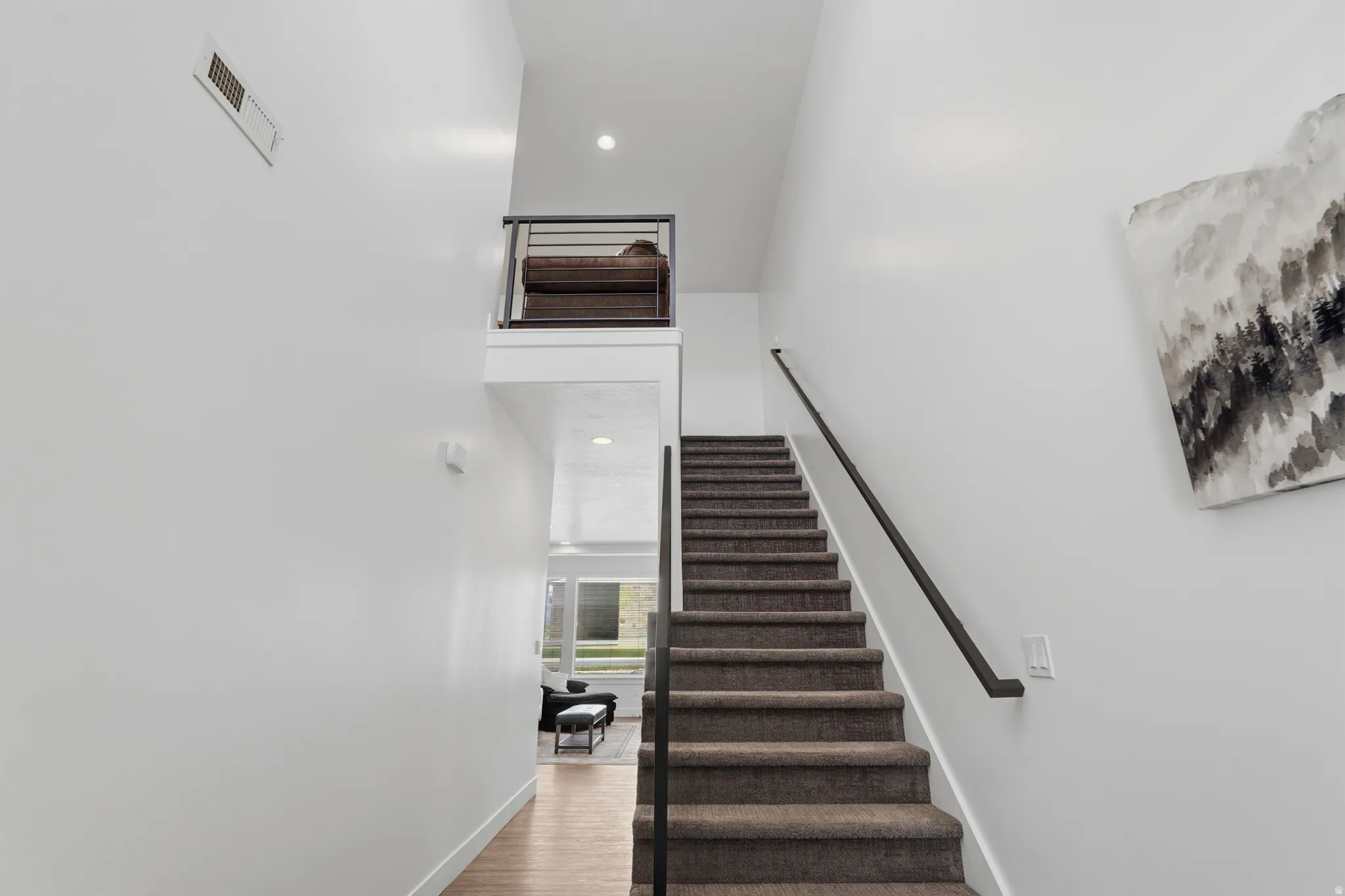 Welcome! Straight ahead to the living space or up the stairs to private and quiet bedrooms
