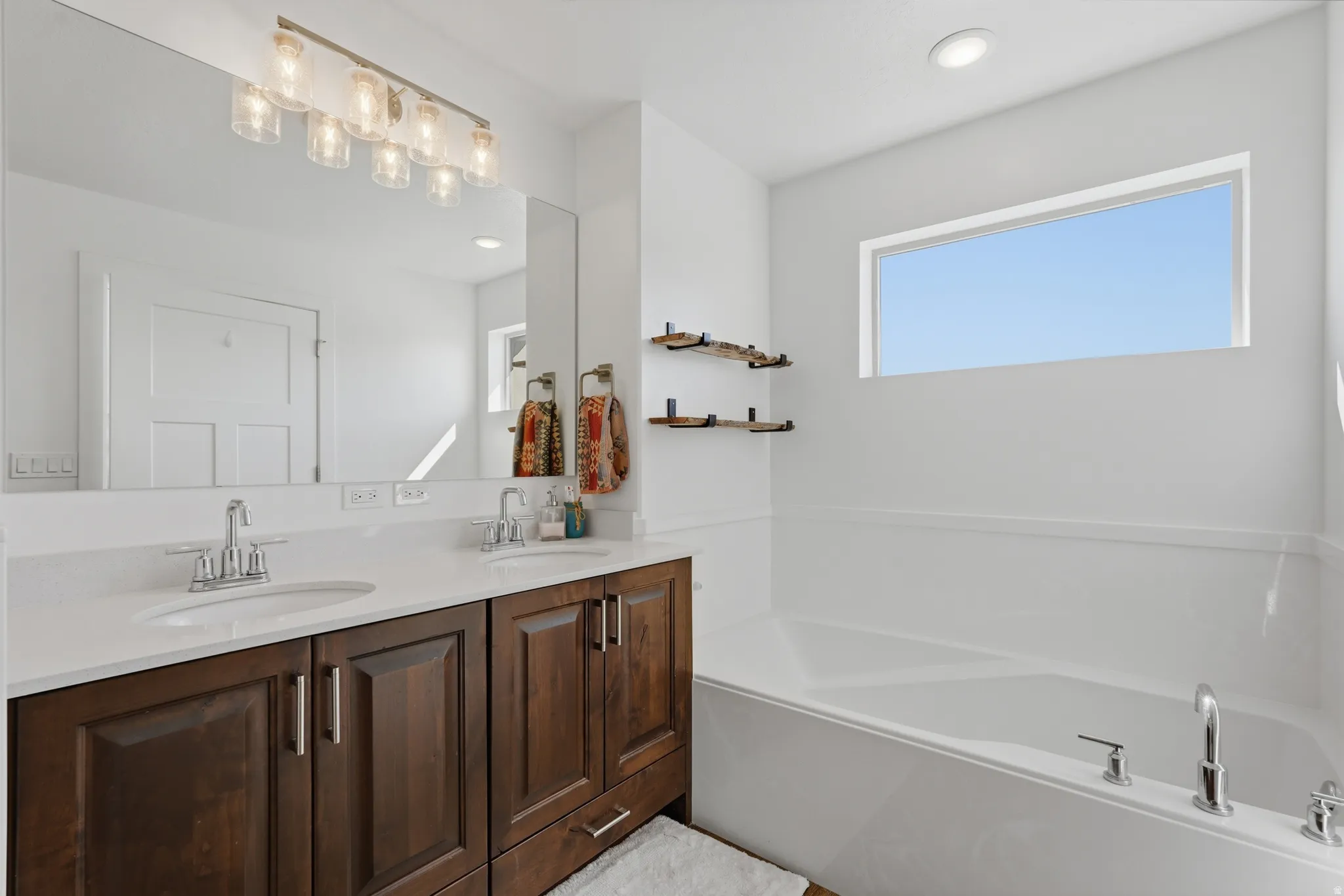 Ensuite bathroom with double vanity, and get a load of that garden tub!