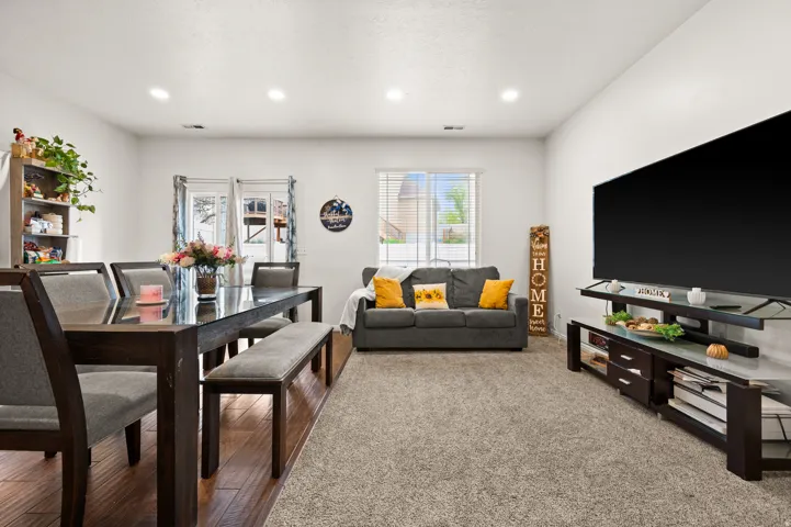 Dining space with carpet flooring and recessed lighting