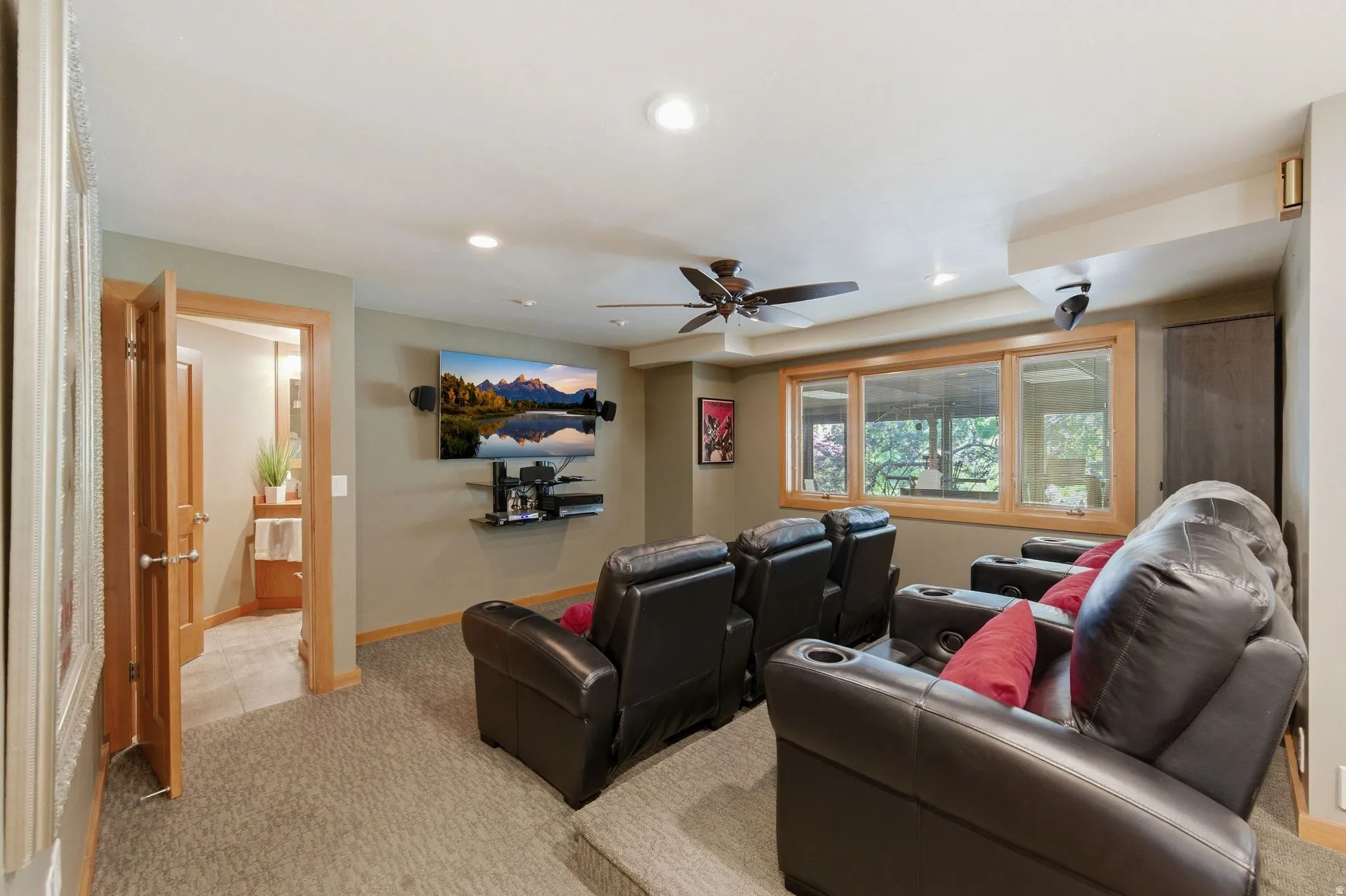 Cinema with light carpet, recessed lighting, and ceiling fan