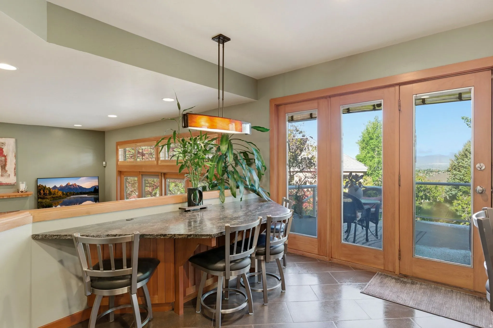 Dining space featuring recessed lighting and stone tile flooring