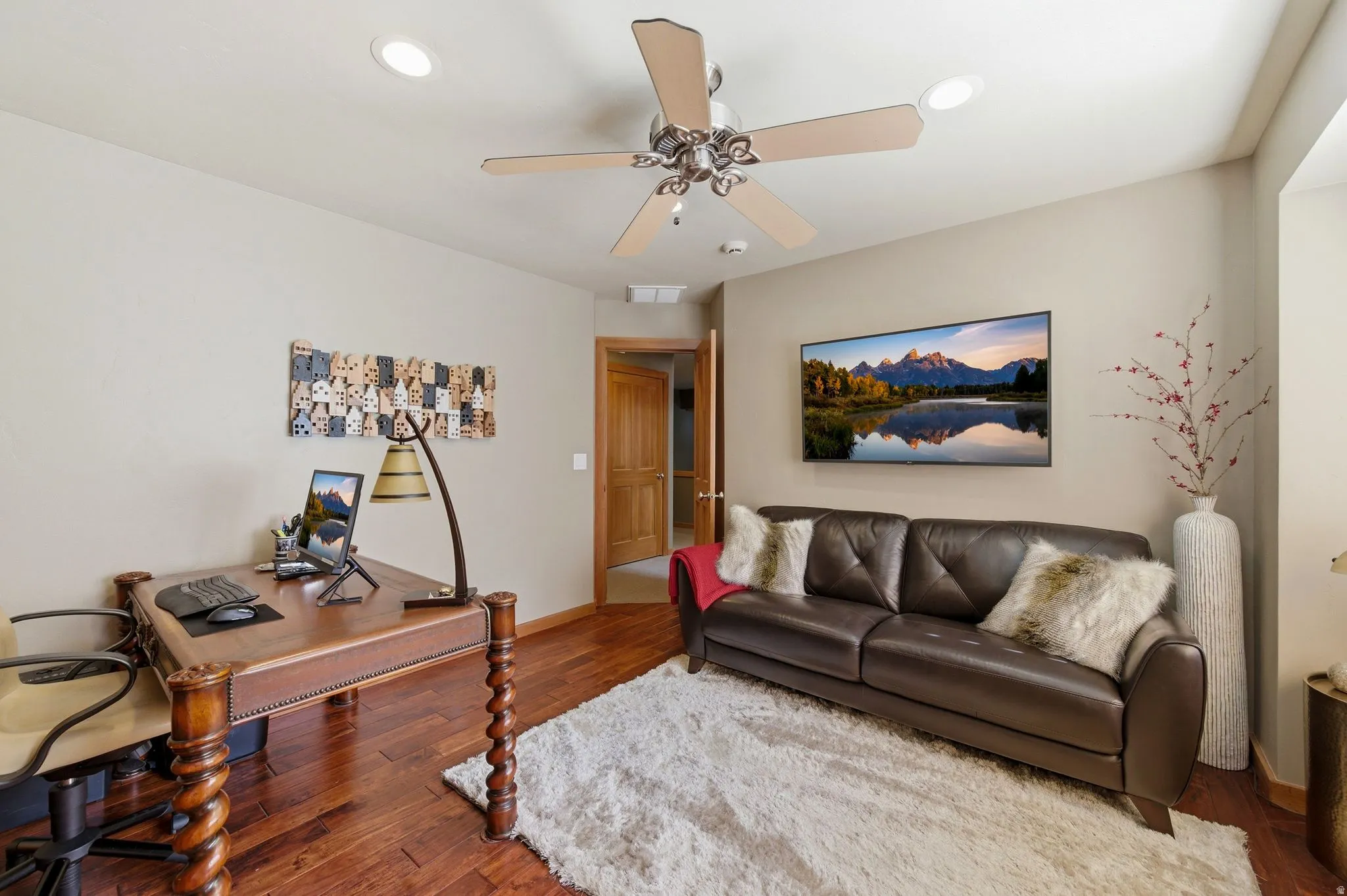 Office space with hardwood / wood-style flooring, a ceiling fan, and recessed lighting