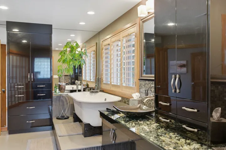 Bathroom featuring recessed lighting, decorative backsplash, a soaking tub, vanity, and light tile patterned flooring
