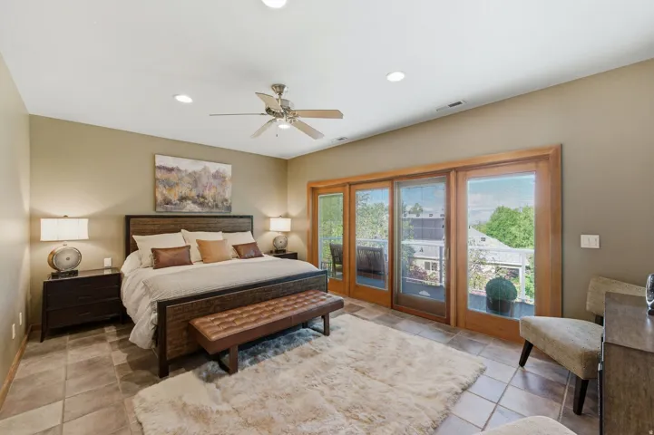 Bedroom with access to exterior, recessed lighting, and a ceiling fan