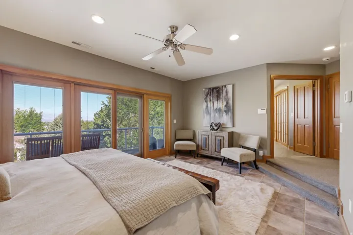 Bedroom featuring access to outside, recessed lighting, and a ceiling fan