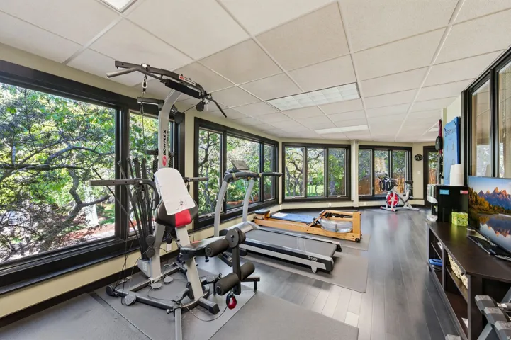Exercise room featuring a drop ceiling