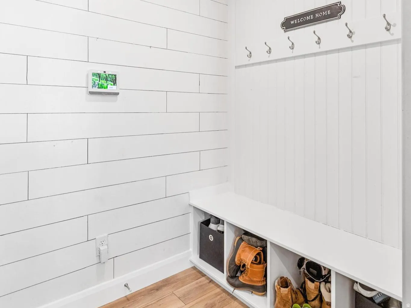 Mudroom with light wood-type flooring