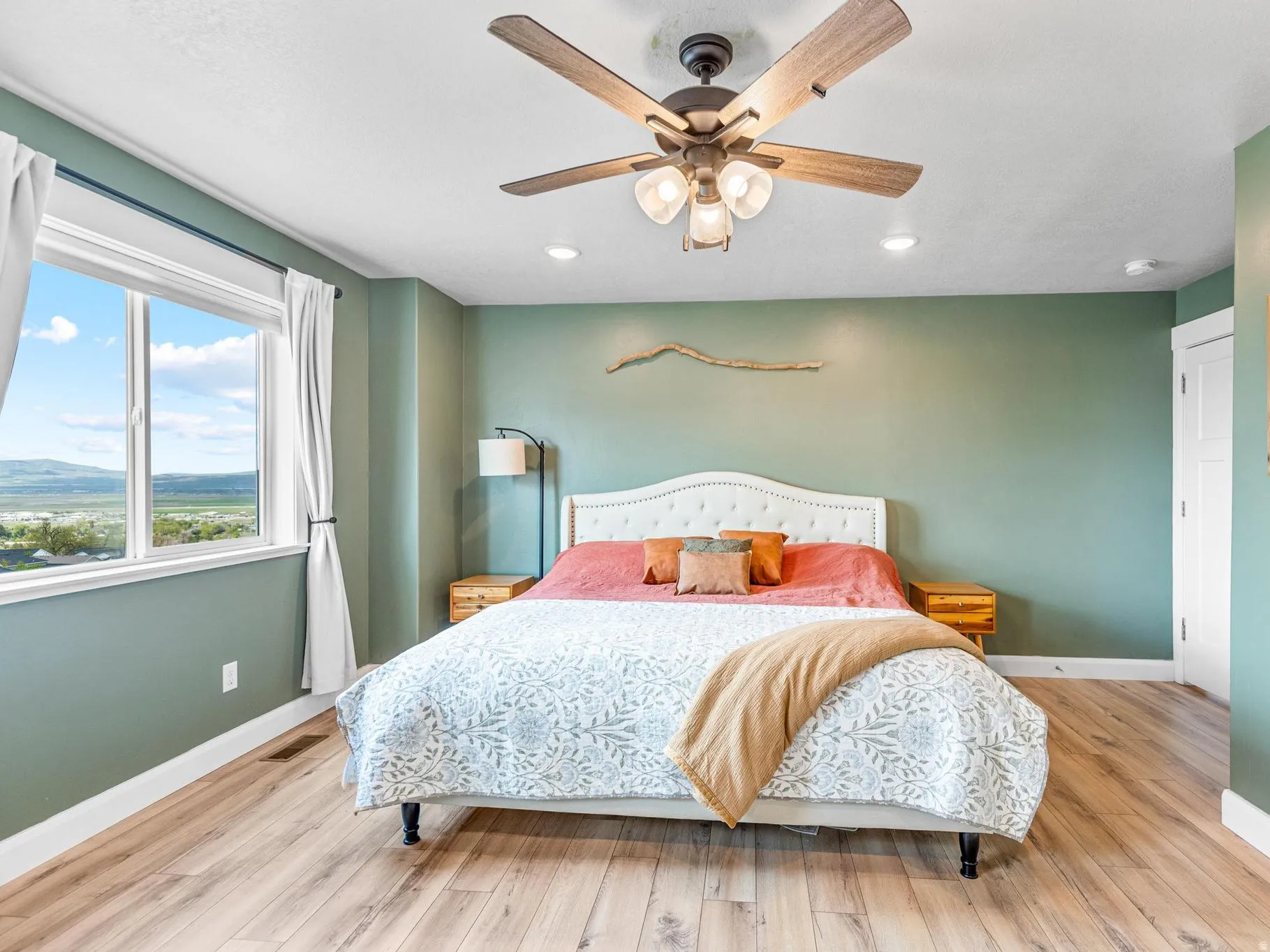 Bedroom with light wood-type flooring, a ceiling fan, and recessed lighting