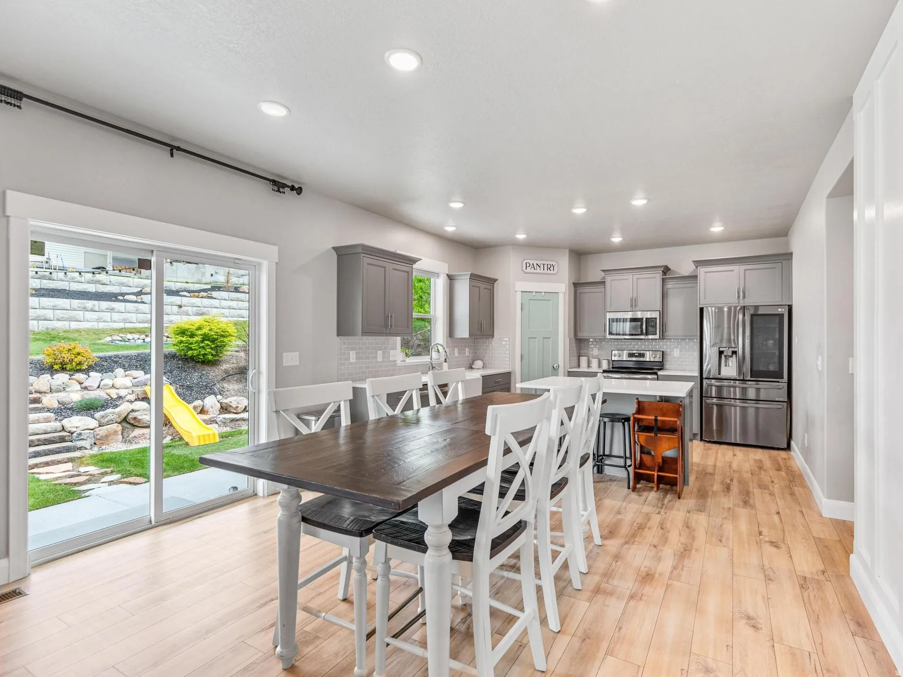Dining area featuring light wood-style floors and recessed lighting