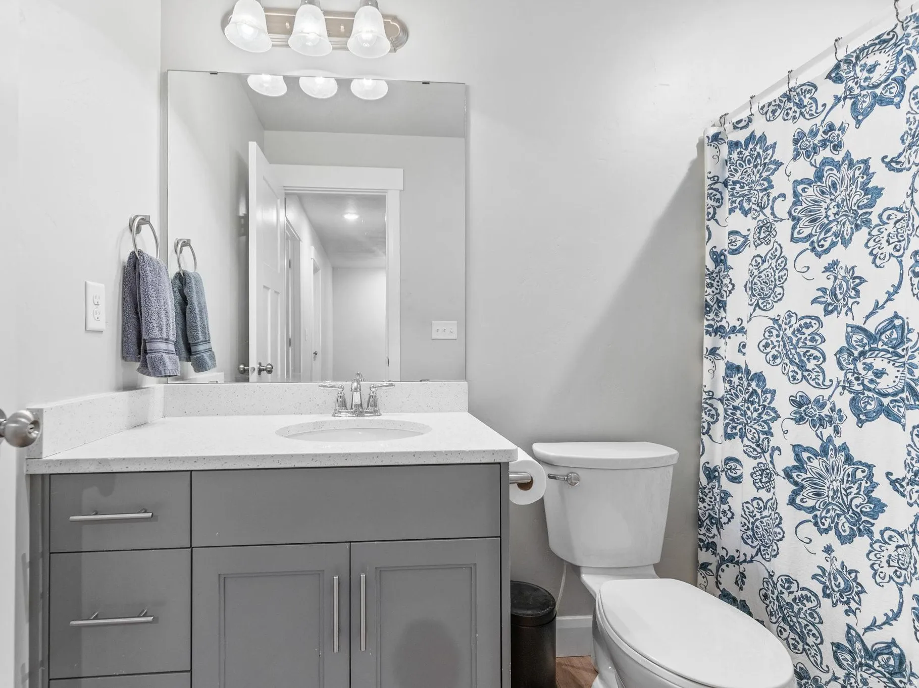 Bathroom with vanity and a shower with shower curtain