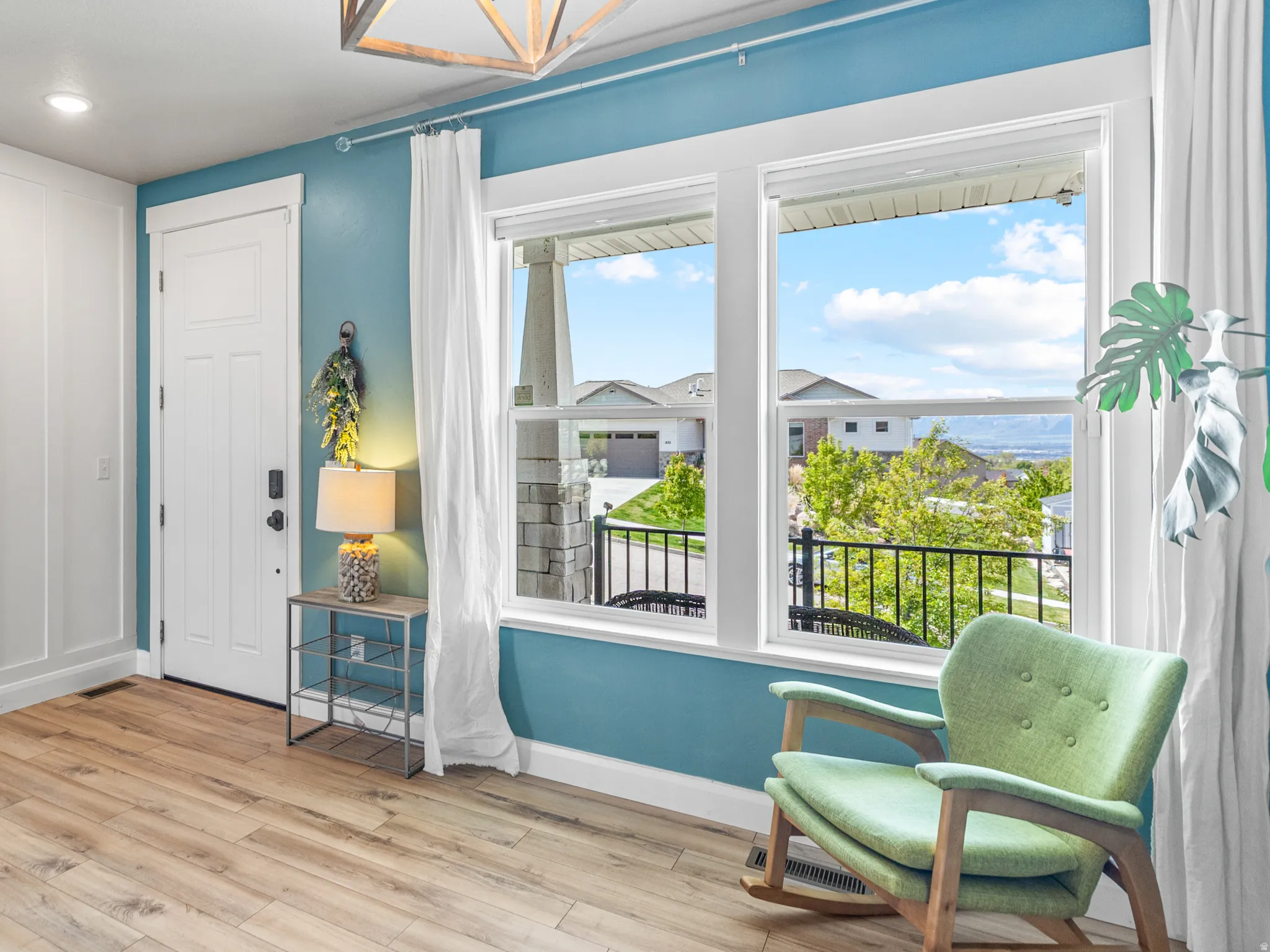 Entryway with a chandelier and light wood-type flooring