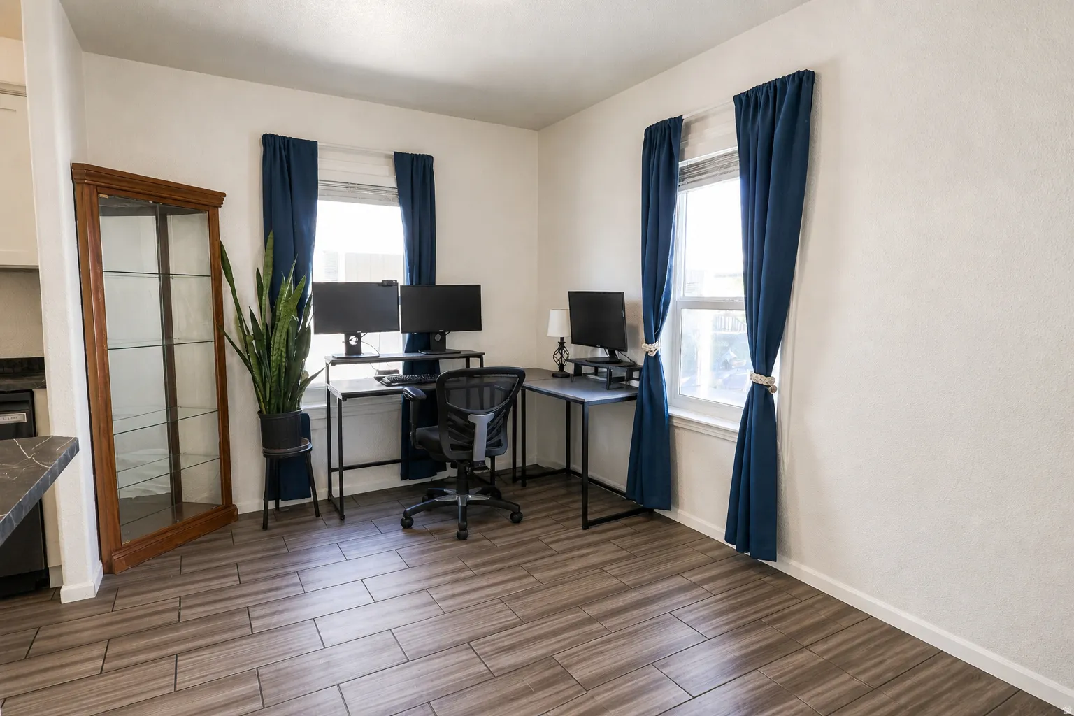 Office featuring wood tiled floors and baseboards
