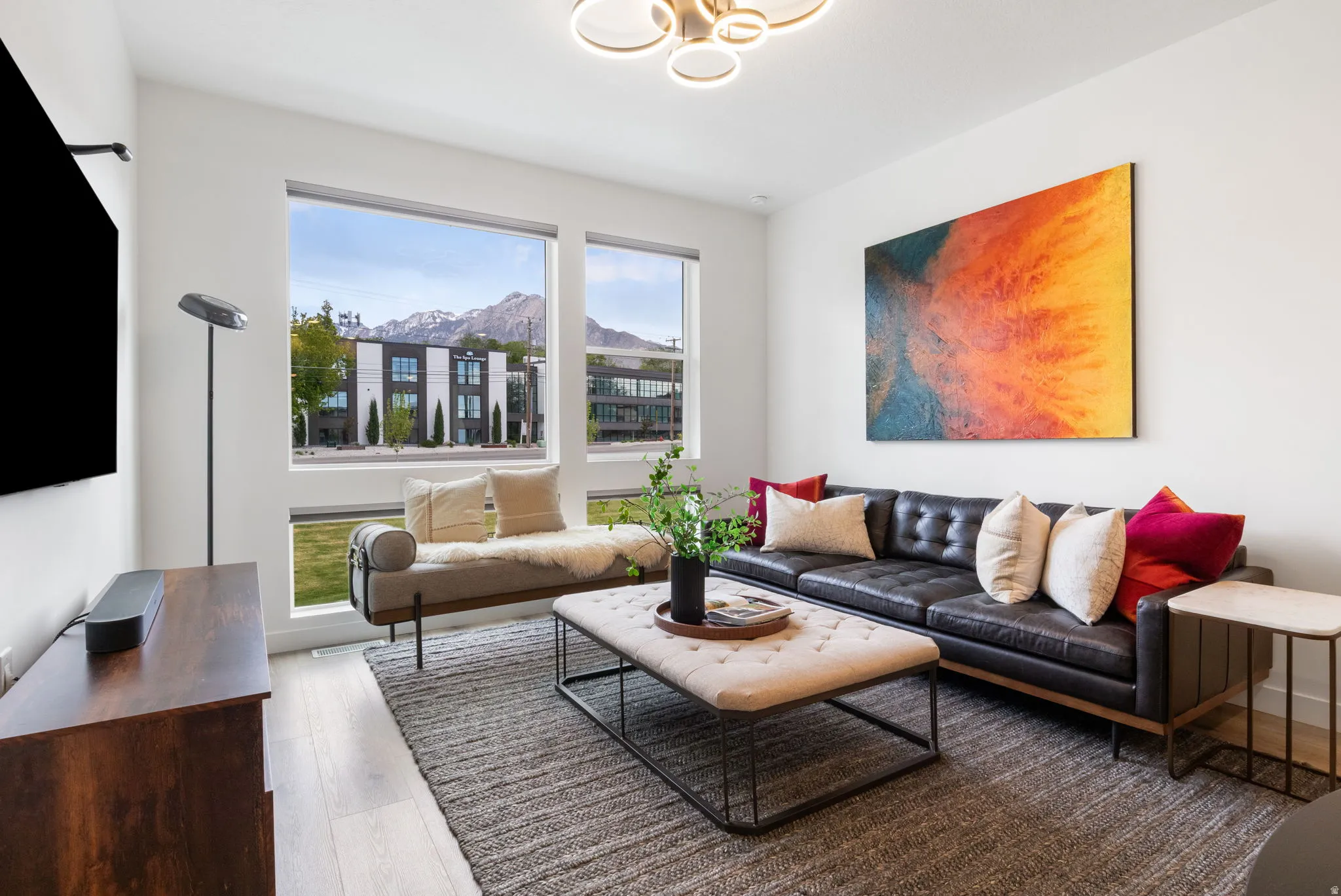 Living area with light wood finished floors and a mountain view