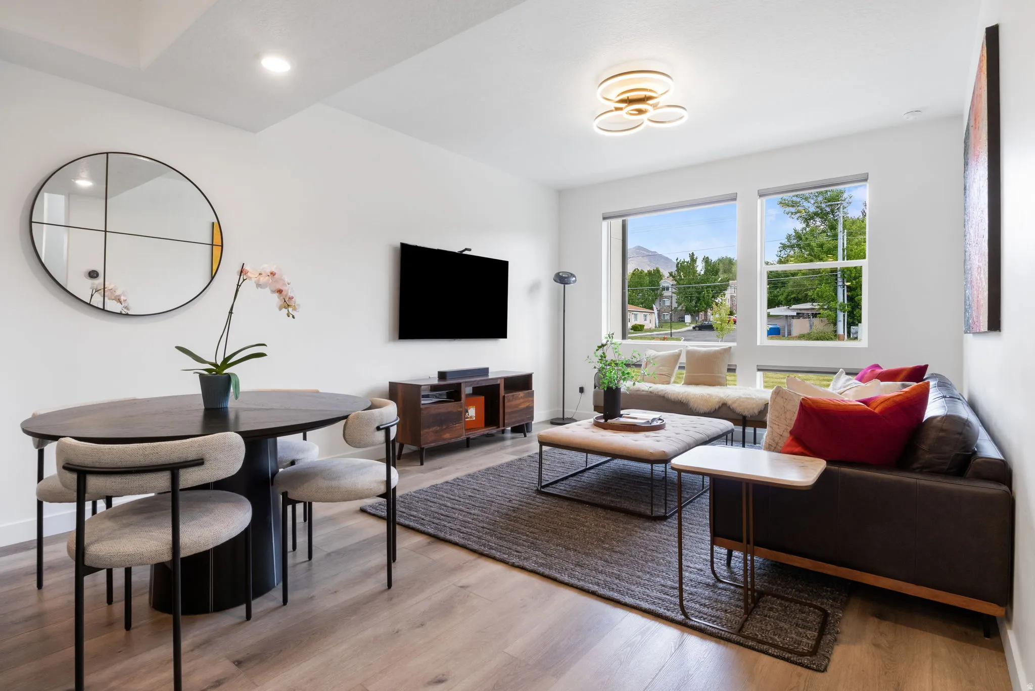 Living area featuring light wood-style flooring and baseboards