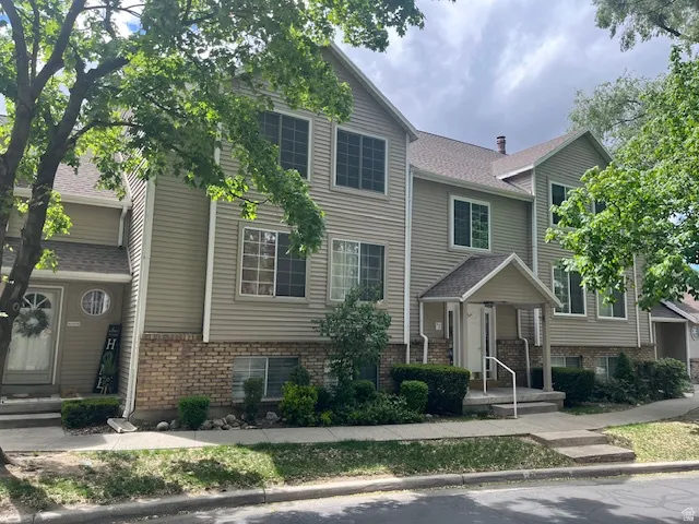 View of front of house with brick siding