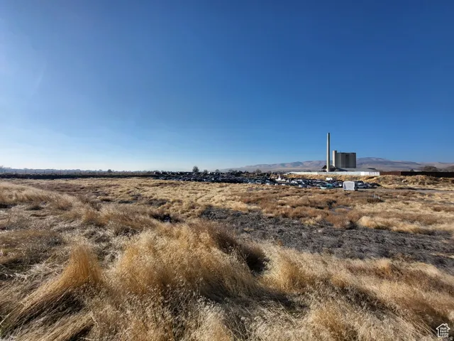 View of local wilderness featuring a mountain backdrop and rural landscape