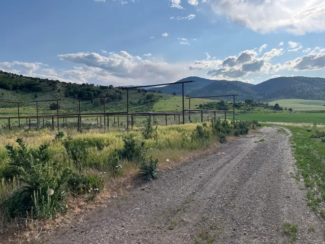 View of mountain backdrop featuring rural landscape