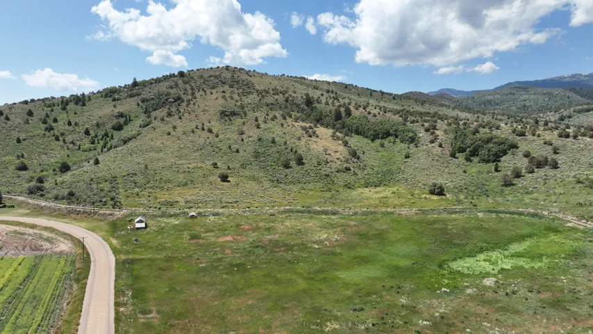 View of mountain background featuring rural landscape