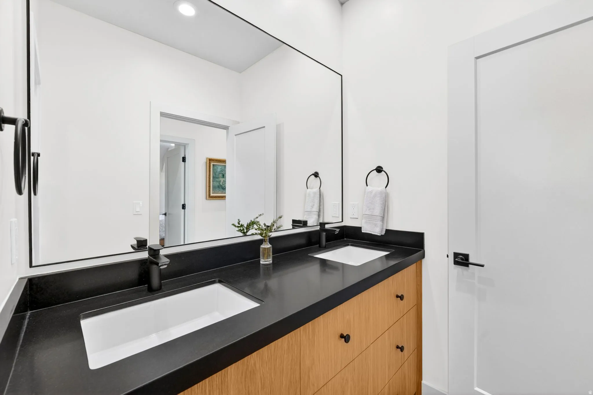 Full bath with double vanity and recessed lighting