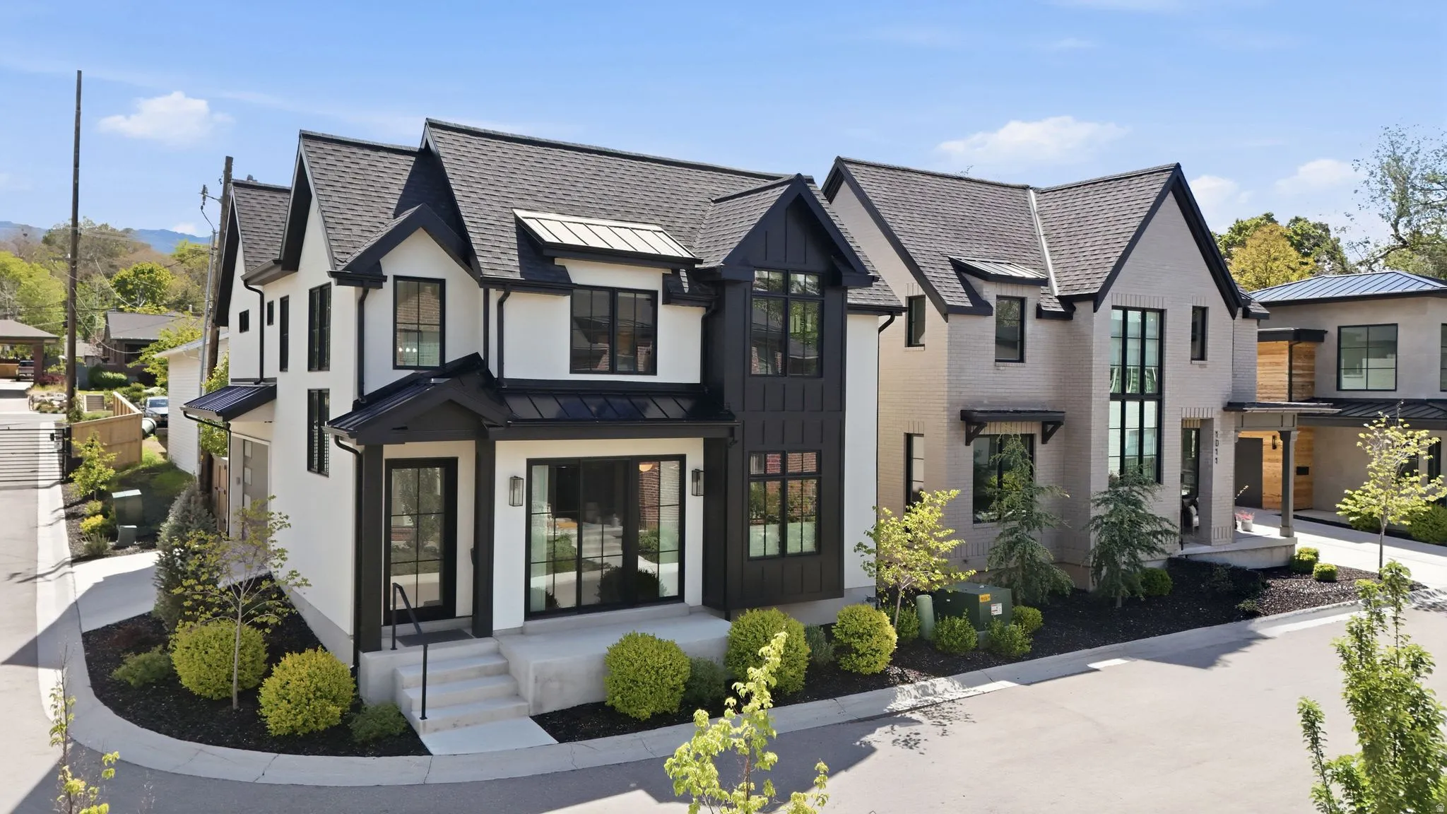 View of front of property with a standing seam roof and a shingled roof