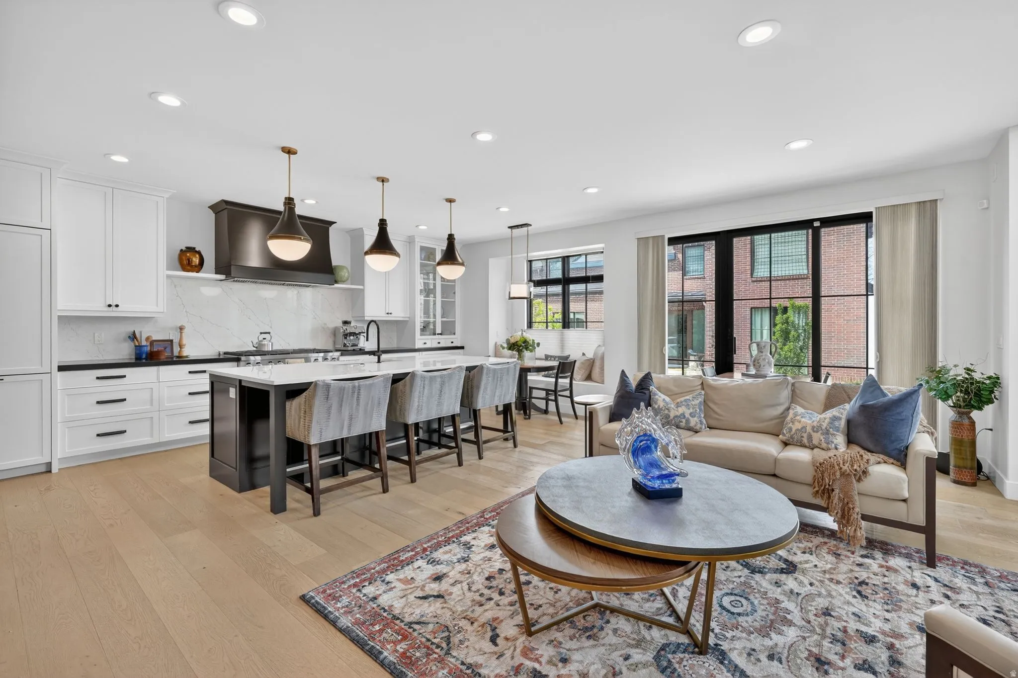 Living area featuring light wood-style flooring and recessed lighting