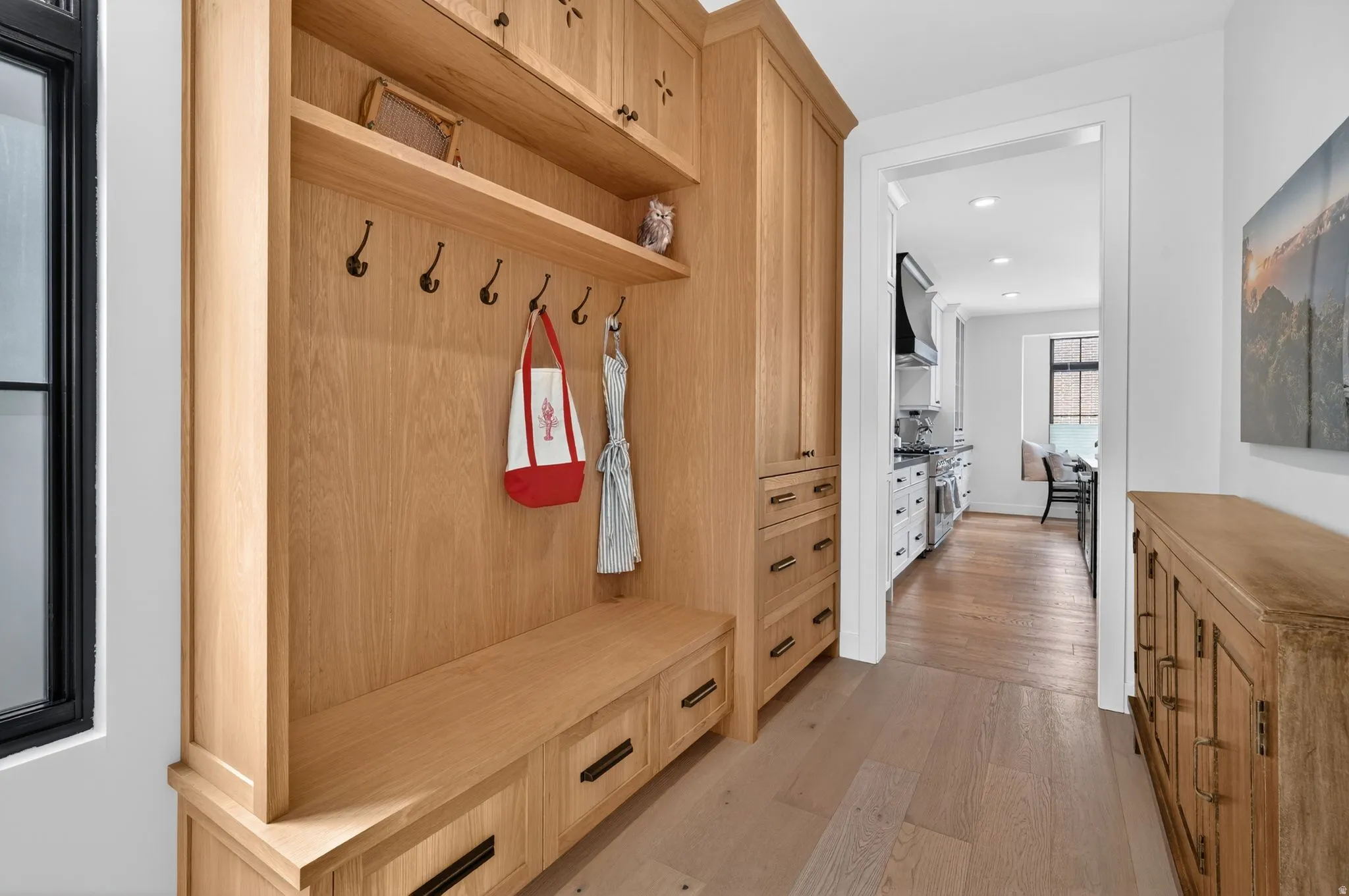 Mudroom featuring light wood-style floors and recessed lighting