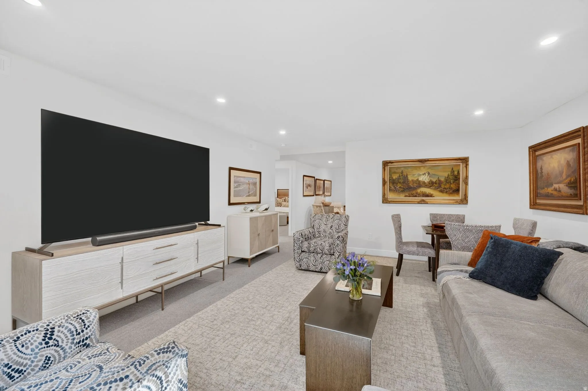 Living room with light carpet and recessed lighting