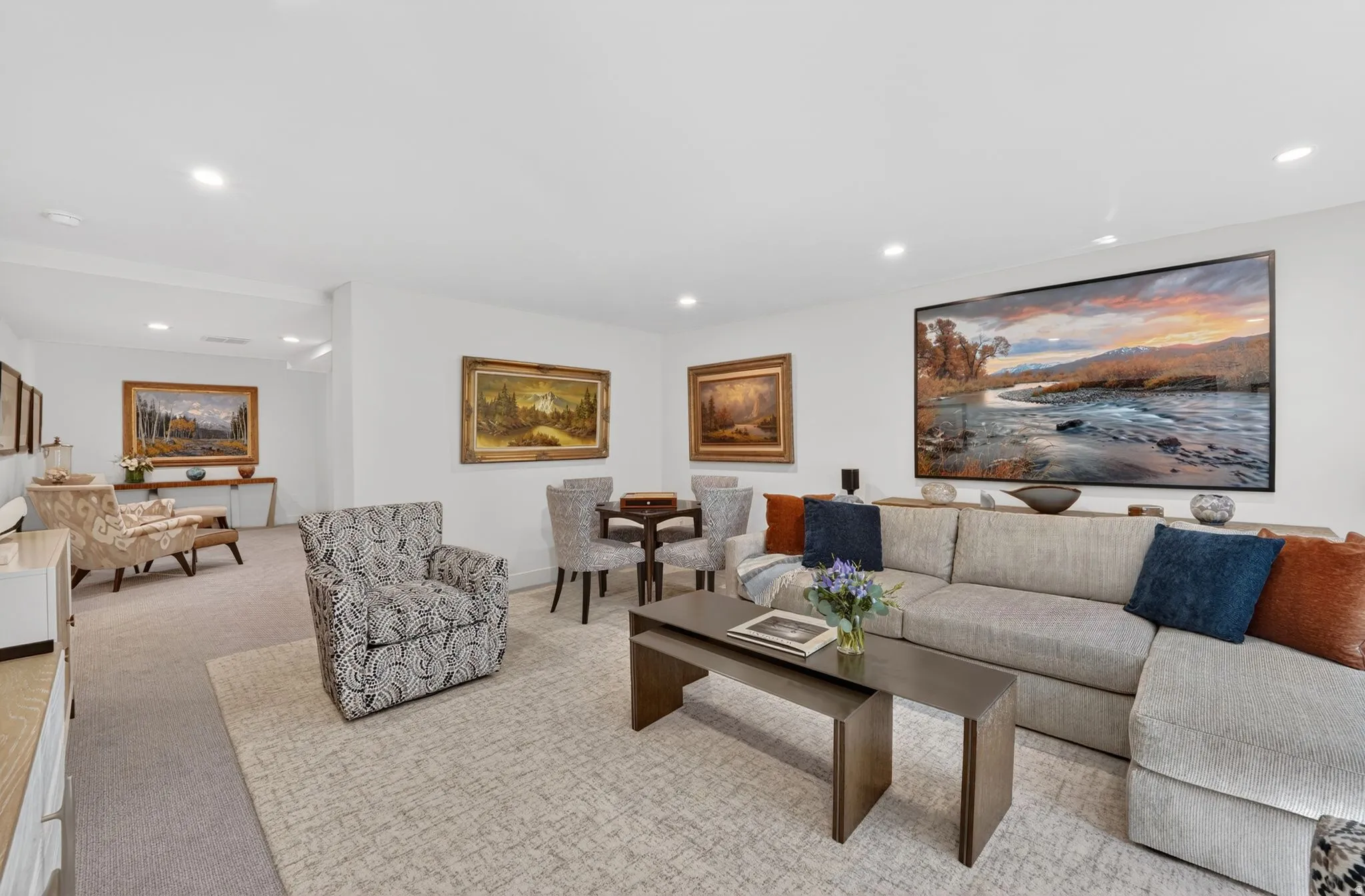 Living area featuring light carpet and recessed lighting