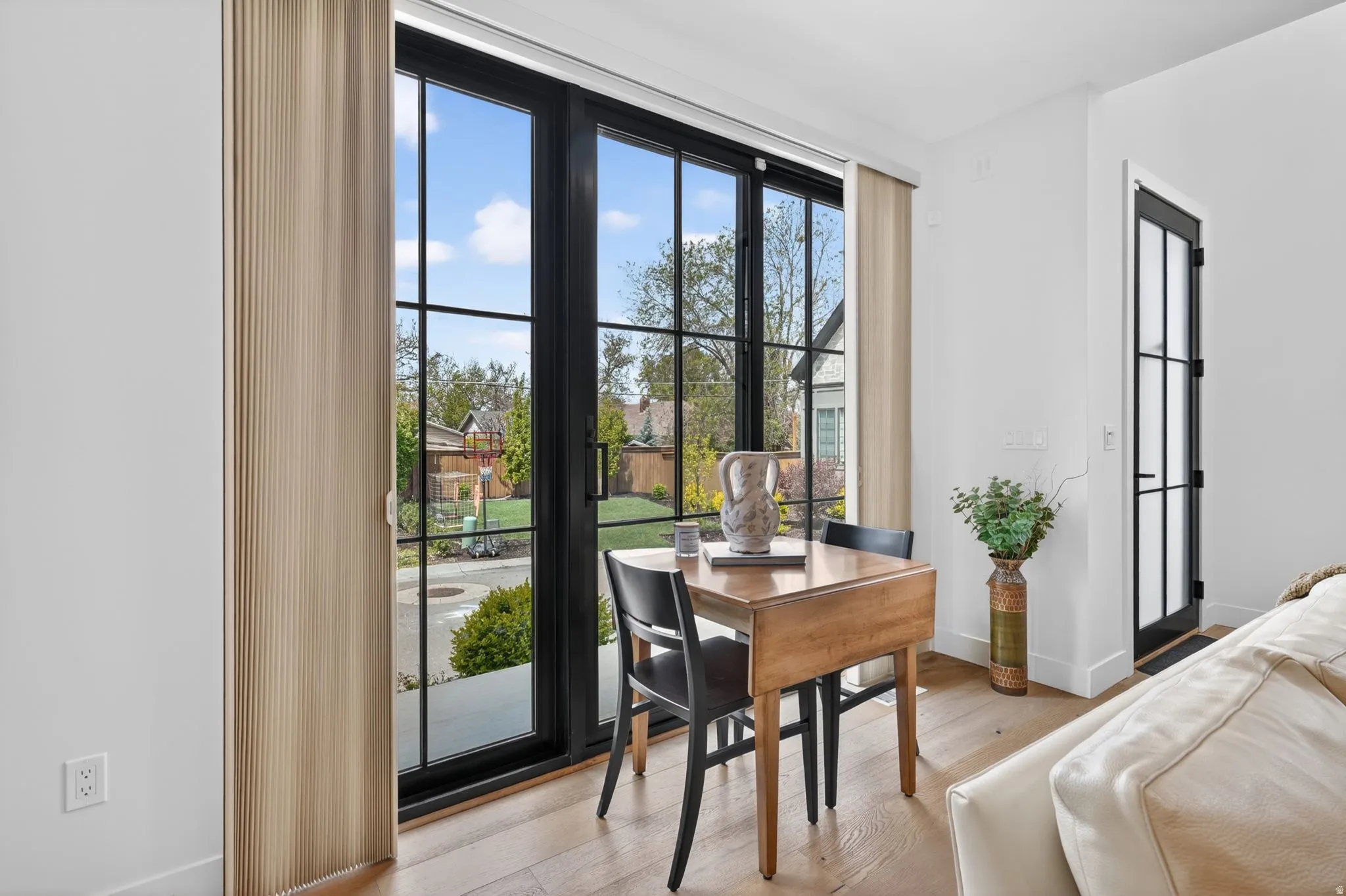 Dining room with light wood-style flooring and a desk