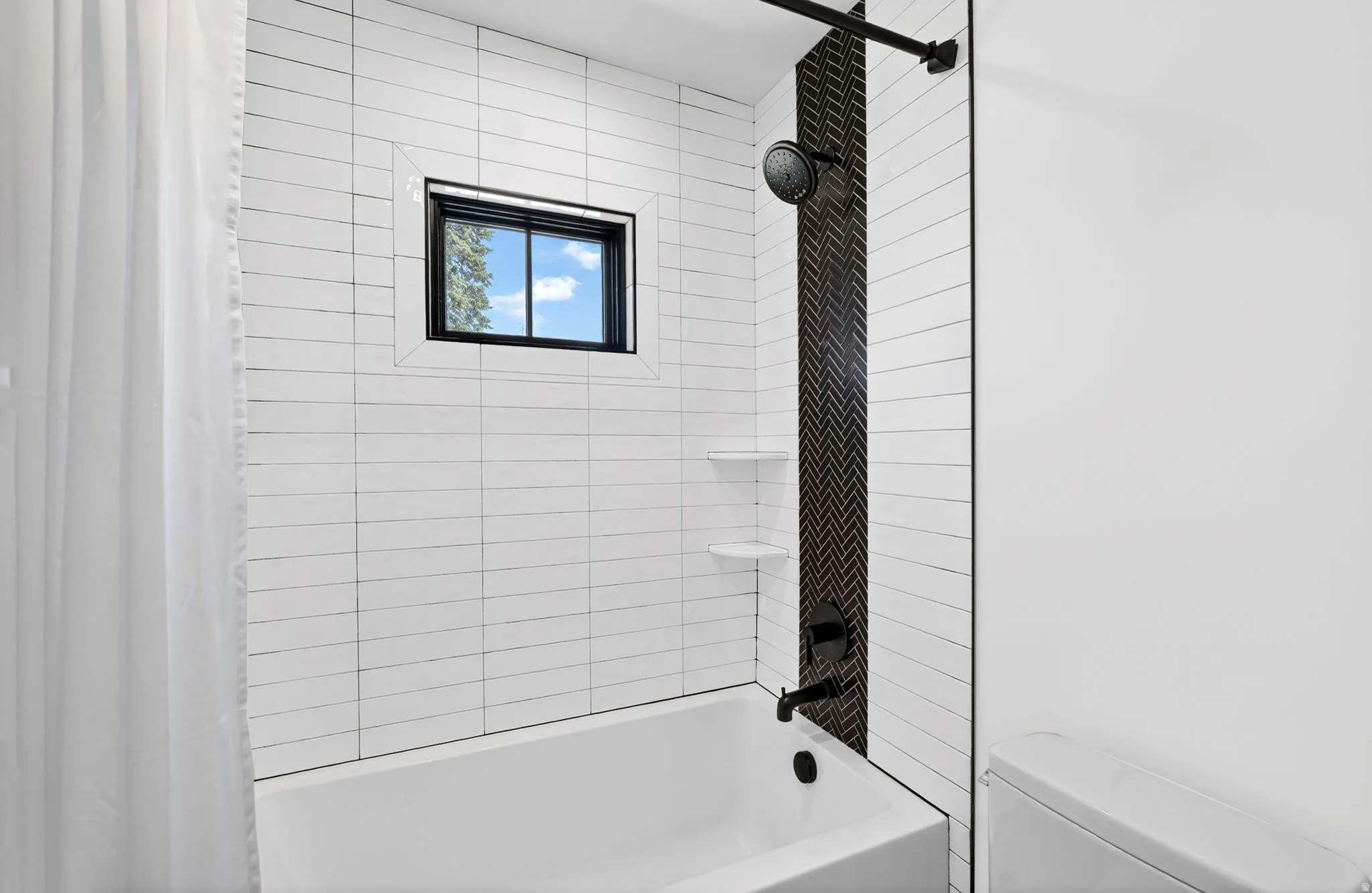 Full bathroom with shower / bathtub combo, tile walls and floor