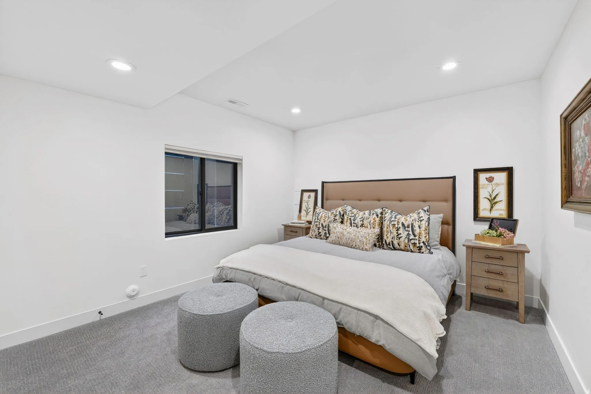 Carpeted bedroom with baseboards and recessed lighting